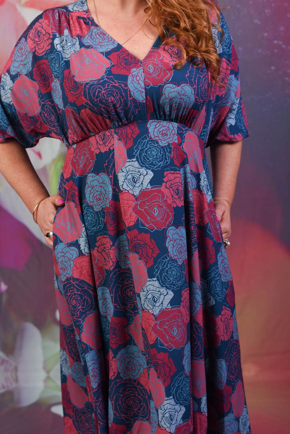 Closer shot of red and blue peony fabric on the Annah Stretton Peony Love dress