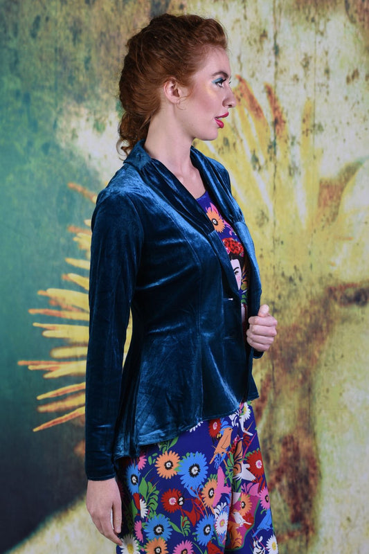 Side of model wearing the Annah Stretton Ady Grace jacket in teal