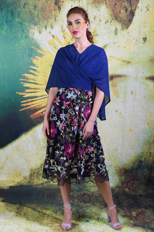 Model wearing the tied Alison Cape in navy