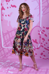 Model wearing the Annah Stretton Allure Alyssa dress with pink background