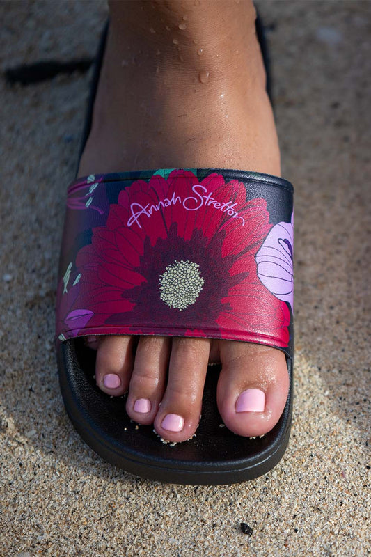 Gerbera floral slide on the beach