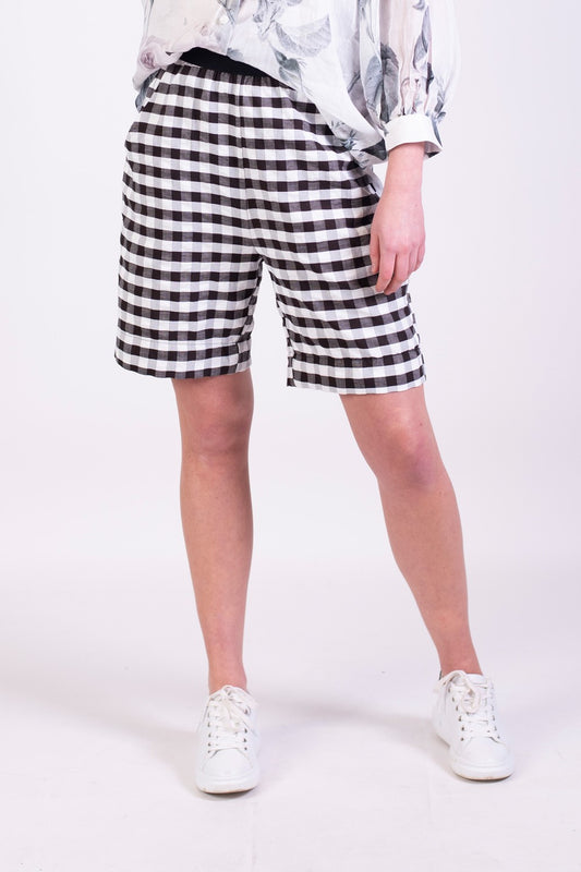 cal shorts in black and white checker print, loose fitting with elastic waist band