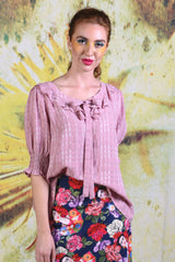 Closer-up of model wearing the Annah Stretton Tiger Lily top in dusky pink
