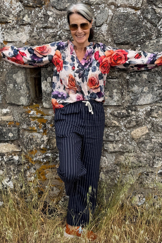 Rosewater floral blouse with V neckline and pleated details