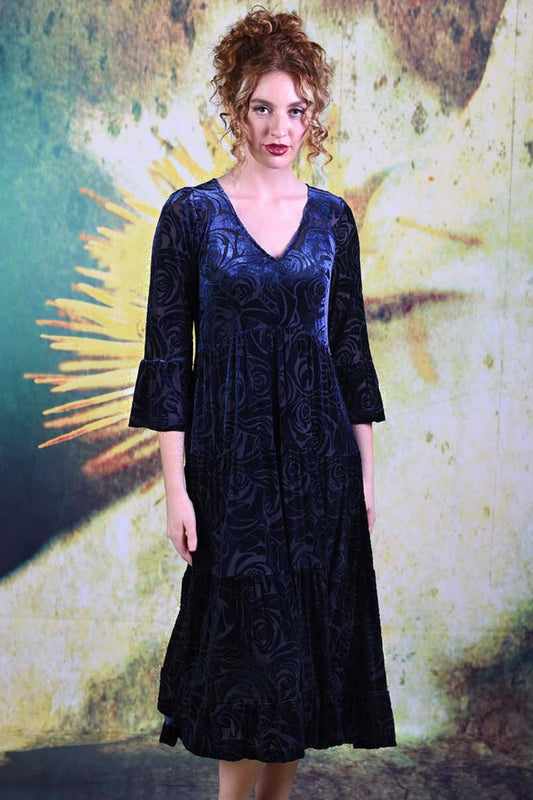 Model wearing the Annah Stretton Magic velvet dress in blue