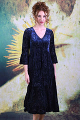 Model wearing the Annah Stretton Magic velvet dress in blue