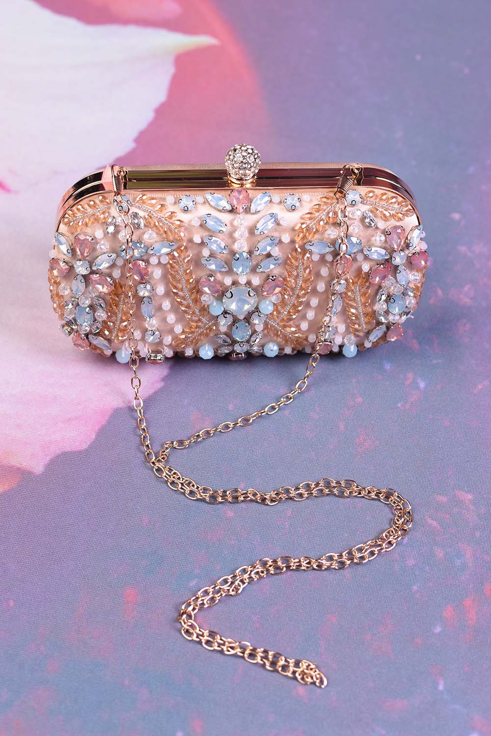Top clasp of the Annah Stretton Champagne Lover clutch bag