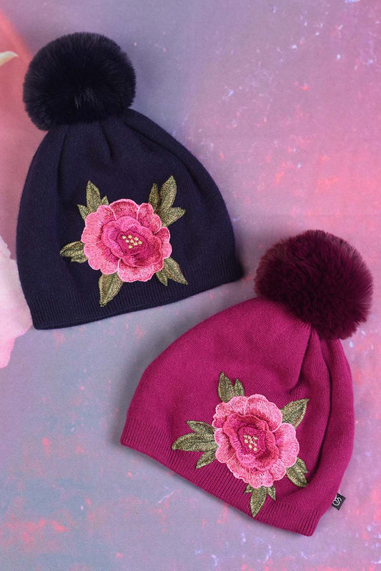 Both the Eden Beanie in cerise and navy, by Annah Stretton