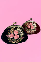 Both of the Annah Stretton Coin purses in wine and navy