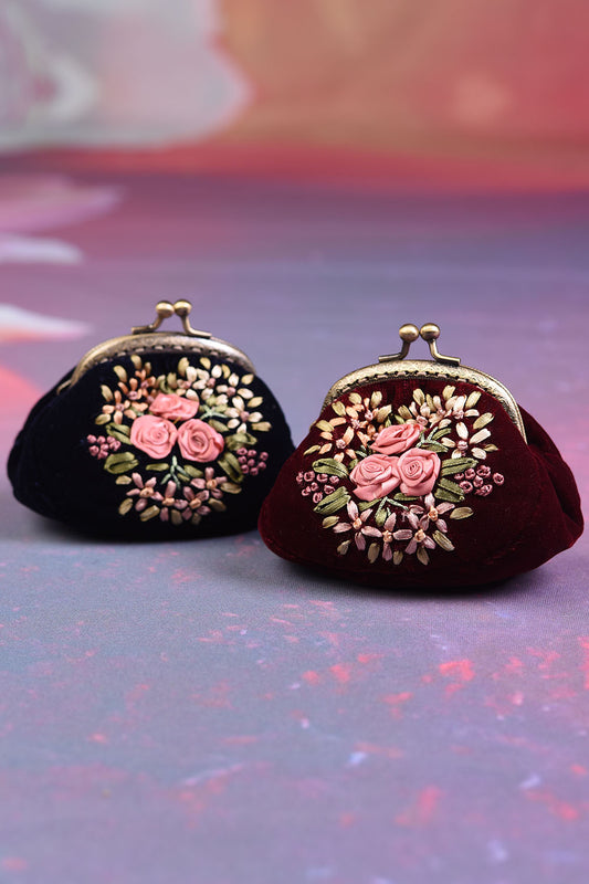 Both the Annah Stretton Edna purses in wine and navy