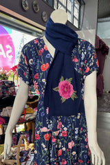 The Annah Stretton Freya Cashmere Scarf in navy on a mannequin