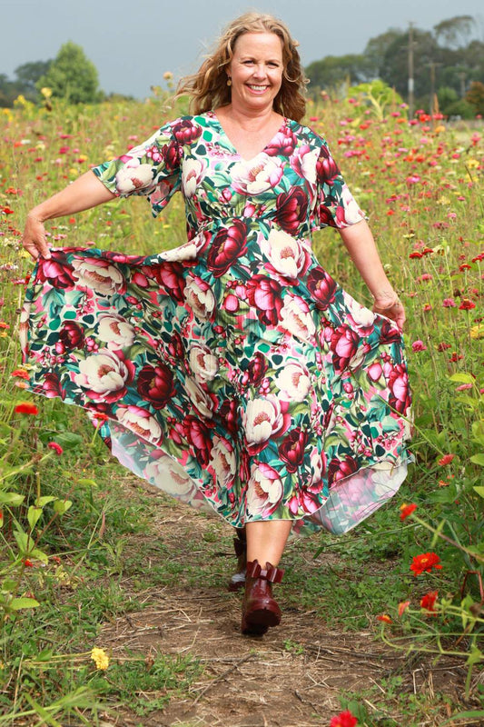 Woman in a floral dress With Bow Gumboots