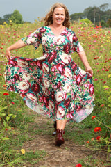 Woman in a floral dress With Bow Gumboots