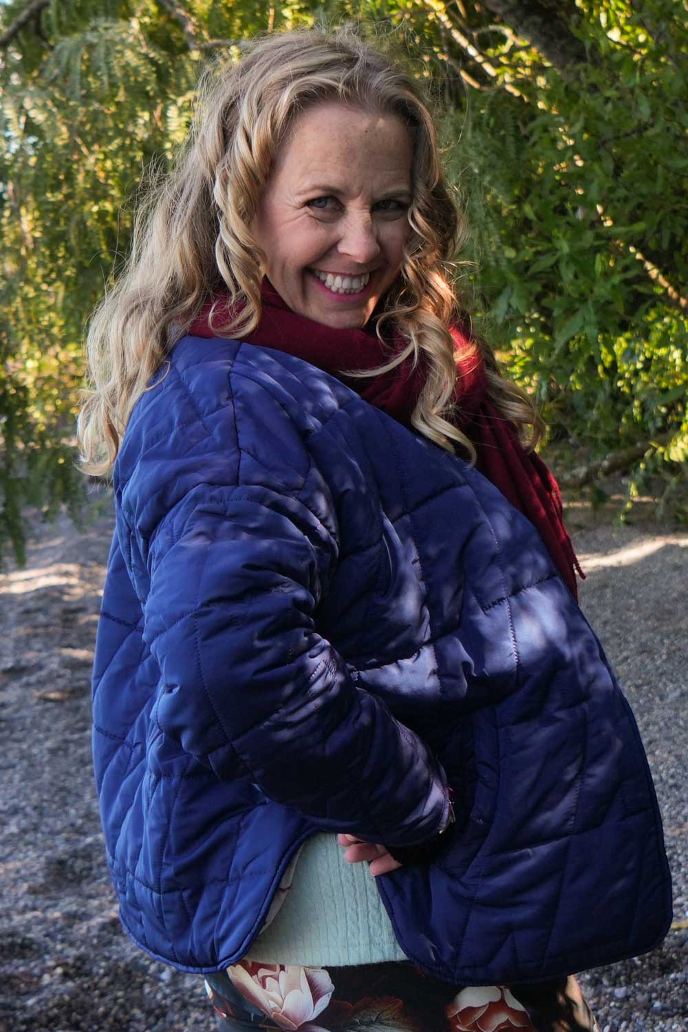 Navy quilted jacket with snap buttons and pockets