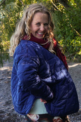 Navy quilted jacket with snap buttons and pockets