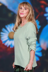 Mint knit sweater with pastel rose trim