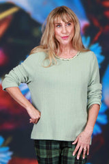 Knit sweater with floral neckline detail