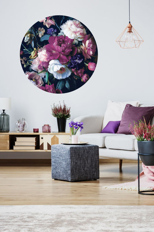 Living room with a floral wall art piece and decorative plants.