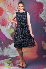 Reverse side of the Ink Flipit Dress showing a navy and white polka dot design
