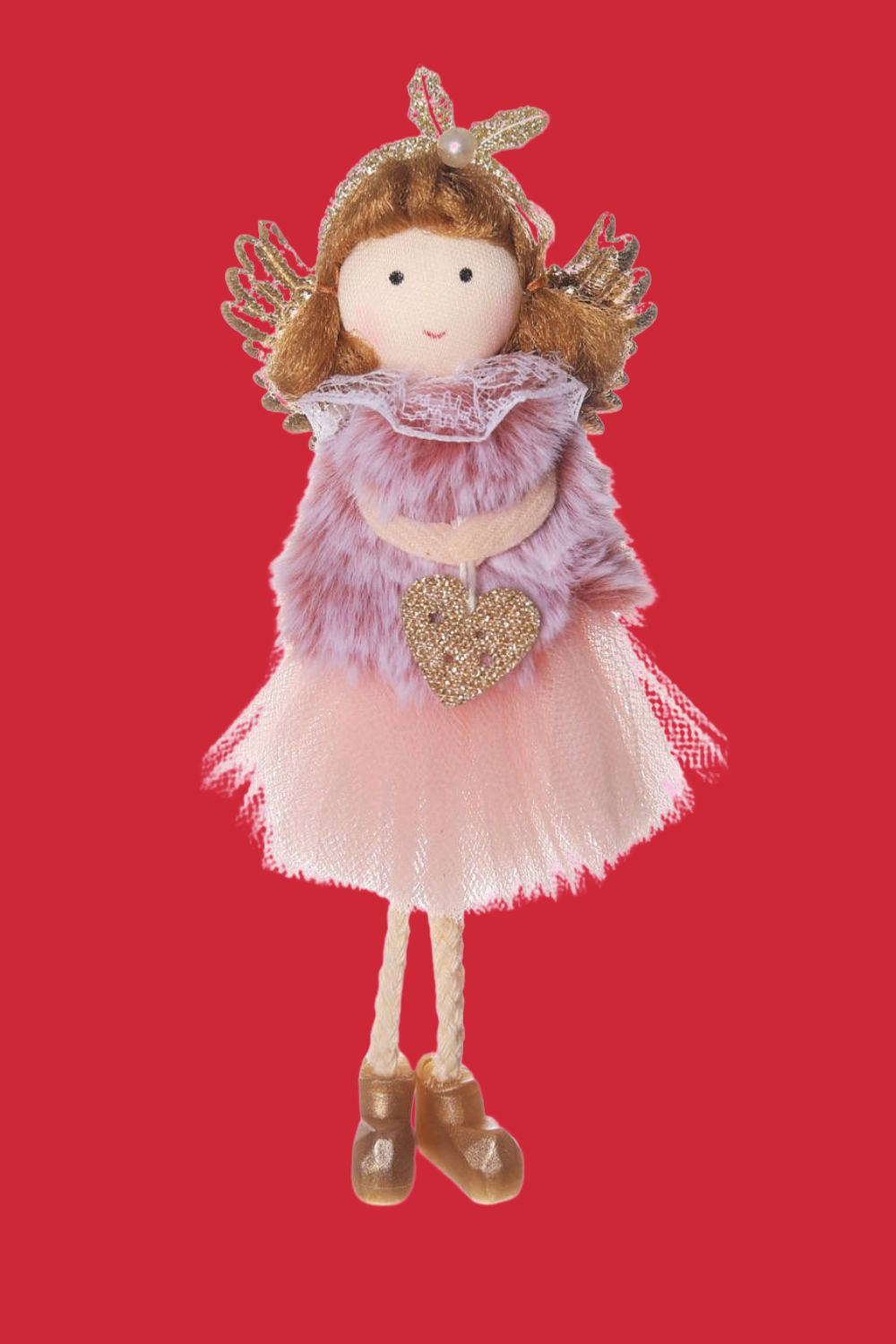 Stuffed doll with a pink dress and decorative accessories on a red background