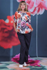 Back view of Amara Blouse Rosewater showing pleated back detail and soft floral rose print