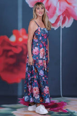 Full length floral maxi dress with flowing tiered skirt and wide shoulder straps in botanical print