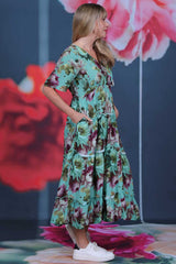 Pretty As A Picture Dress Garden Dragon by Annah Stretton – side view showing white ruffle trim between tiers and 128cm midi length in teal floral viscose