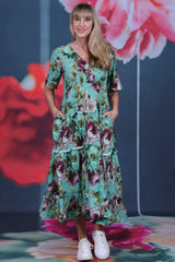 Pretty As A Picture Dress Garden Dragon by Annah Stretton – front view showing V-neckline, tiered ruffle skirt and Garden Dragon floral print in teal and burgundy