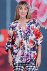 Zola Blouse floral top paired with check
 pants