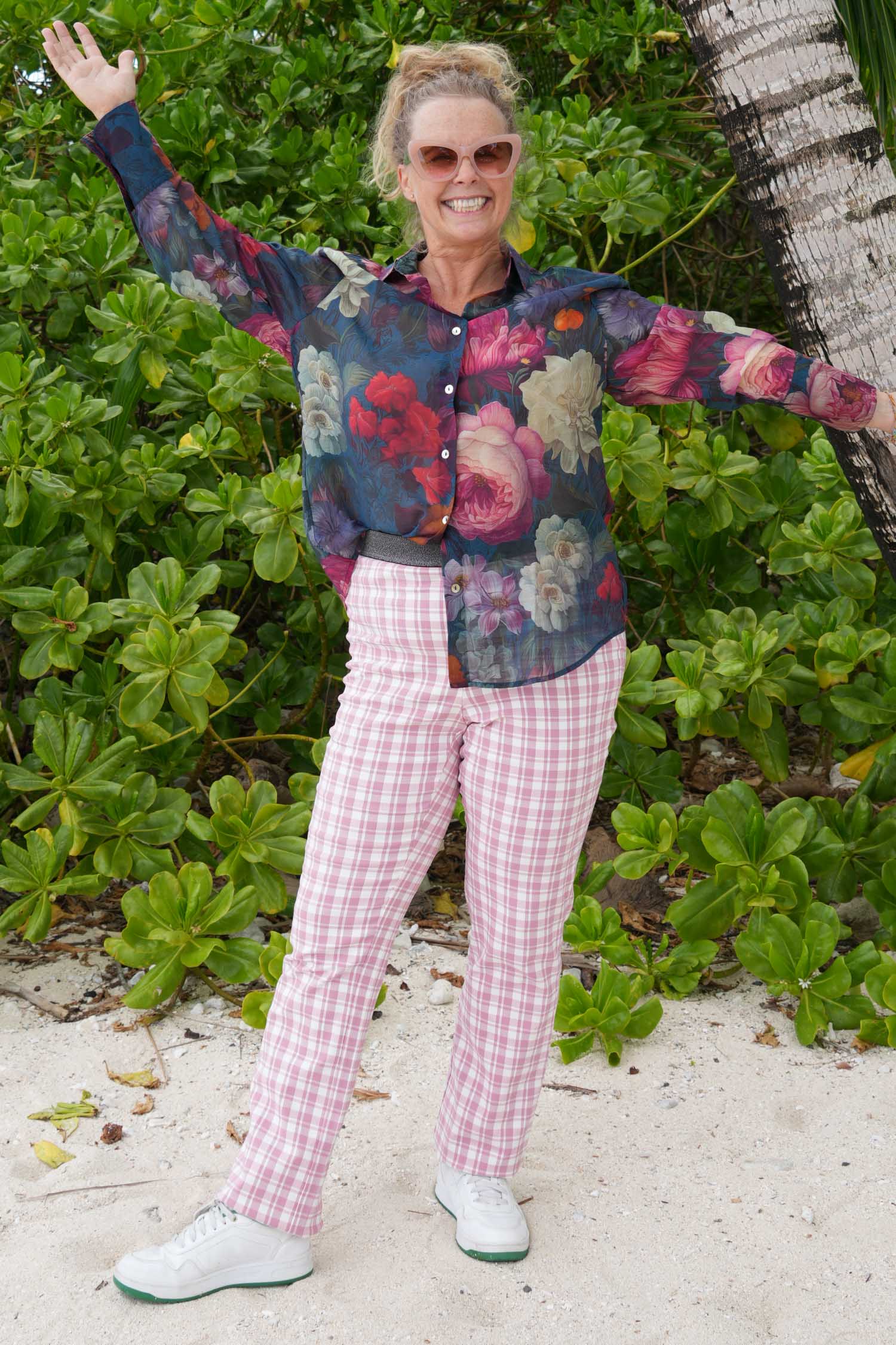Woman wearing floral button-up shirt with collar – Annah Stretton