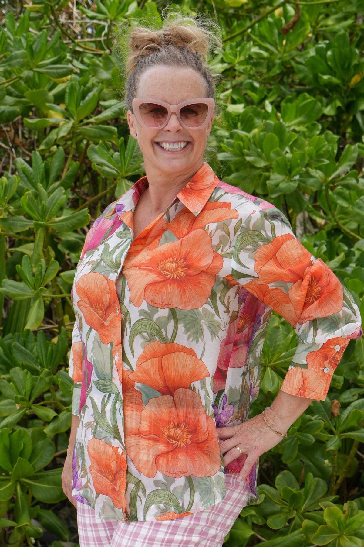 Woman wearing bold floral button-up shirt – Annah Stretton fashion