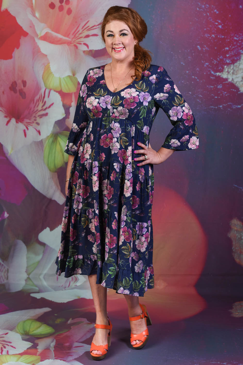 Model wearing navy floral dress