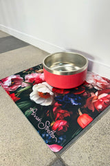 Floral mat with a red pet bowl