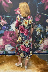 Back view Nancy Ivy Pleated Dress Jungle Mulberry – Annah Stretton floral dress