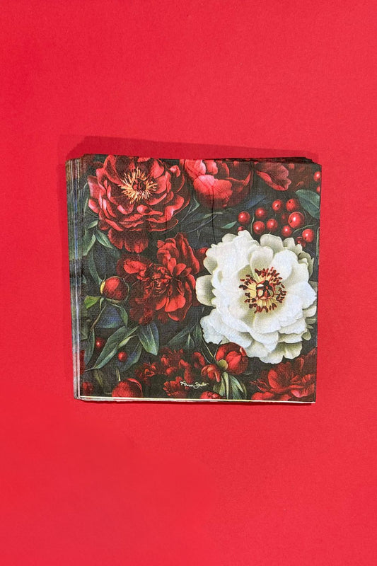 Stack of Annah Stretton Merry Bloom napkins on red background