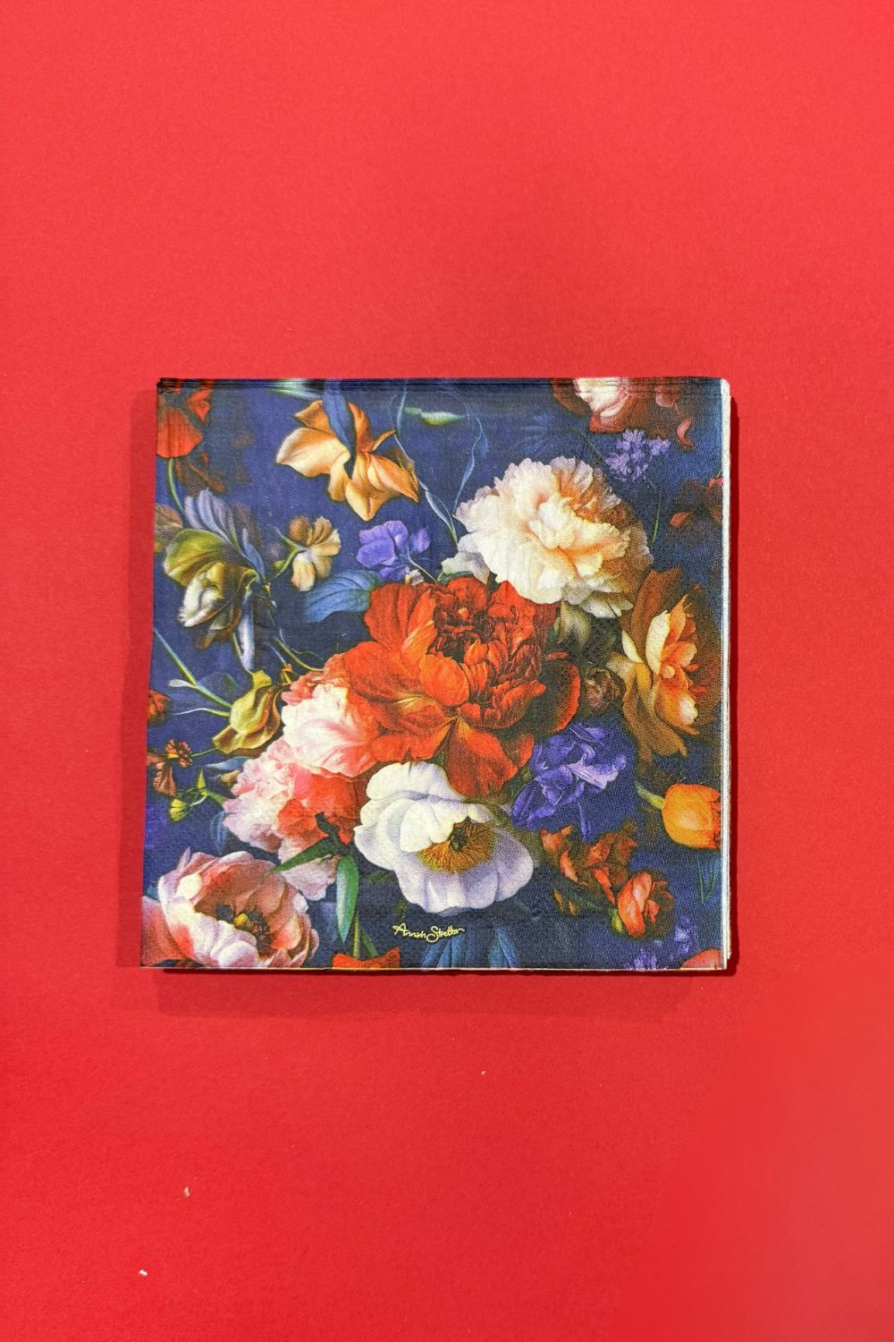 Stack of Petal Chorus Christmas napkins – Annah Stretton holiday tableware