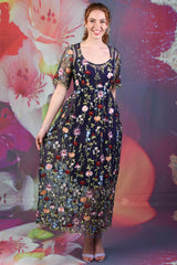 Model showing the floral embroidered pattern on the Nicole dress