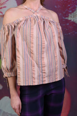 Close-up of the pink George off the shoulder top