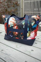 Carry-on size overnight duffel bag in Petal Chorus navy print