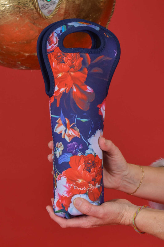 Close-up of Petal Chorus wine bag with bottle inside – festive wine gift idea