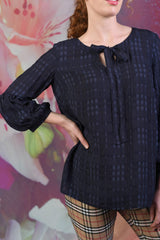 Closer shot of navy check fabric on the Annah Stretton Poison Irene top