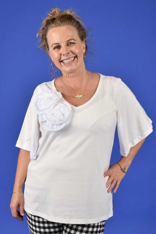 Woman wearing white cotton V-neck tee with bell sleeves – Annah Stretton