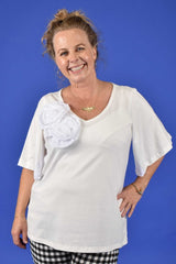 Woman wearing white cotton V-neck tee with bell sleeves – Annah Stretton