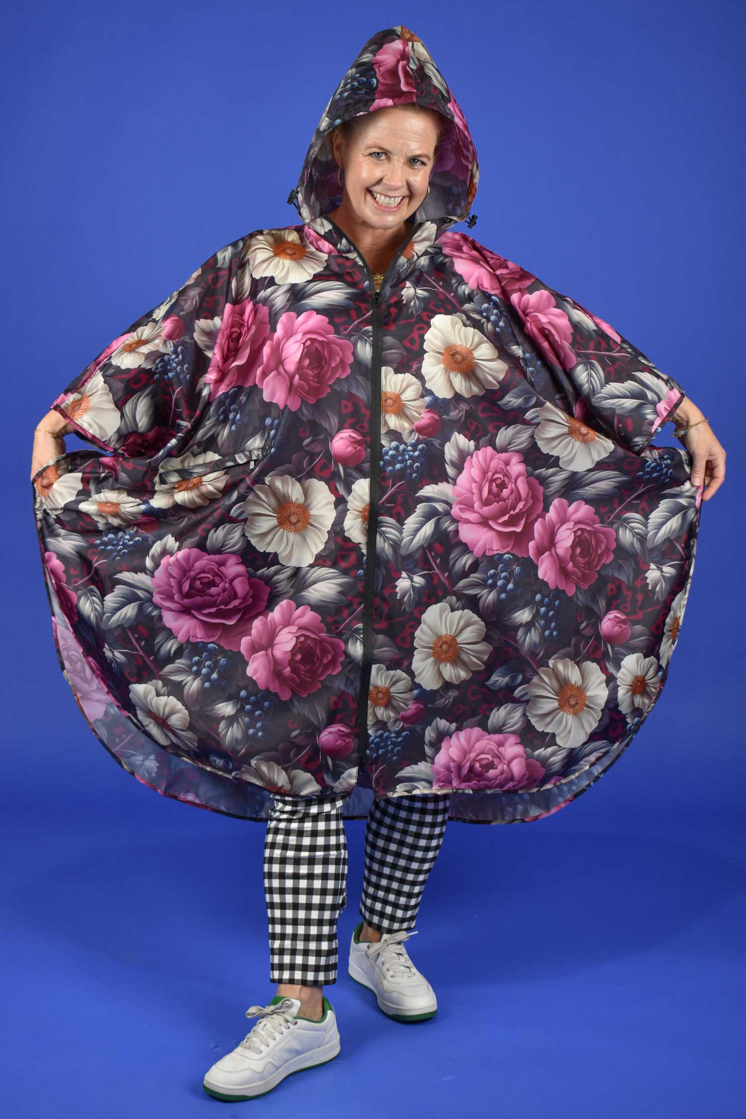 Front view of waterproof women’s rain poncho with zip pocket – Jungle Mulberry print
