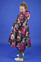 Lightweight travel poncho in Jungle Mulberry floral print – waterproof and packable