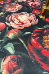 Close-up of Festive Whisper round table runner – bold holiday floral design