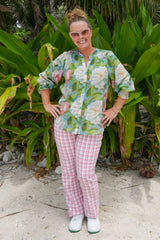 Woman wearing floral cotton blouse with lace fagoting detail