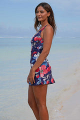 Layla Skirt Bather Blossom Party Annah Stretton – front view showing V-neck crossover bust detail, full lining, high-stretch navy floral fabric with cherries, strawberries, and pink floral print