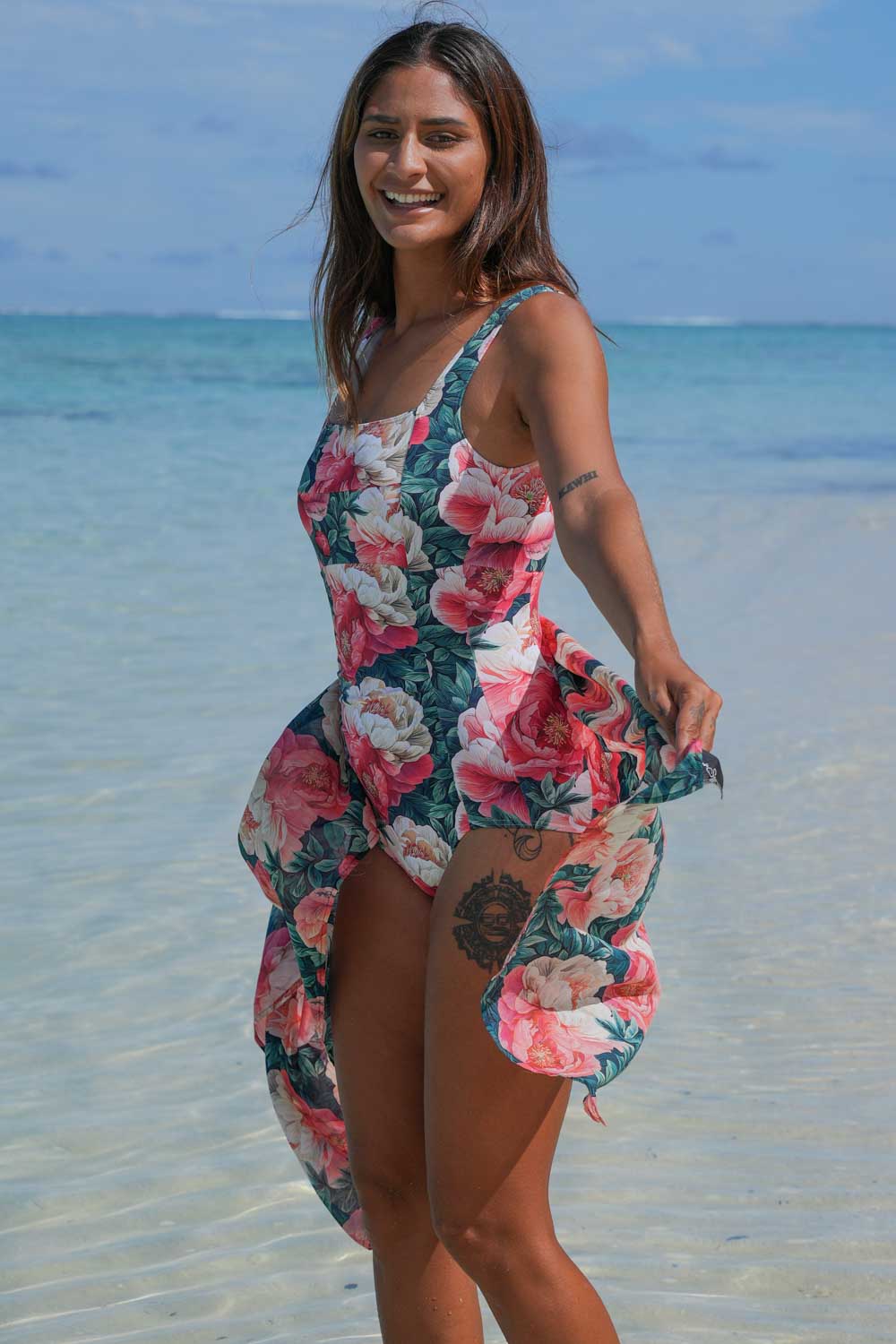 Erika Bather Vintage Peonies Annah Stretton – front angled view showing square neckline, vertical front ruching, classic brief cut, and oversized peony print, styled with matching wrap at beach
Erika Bather Vintage Peonies