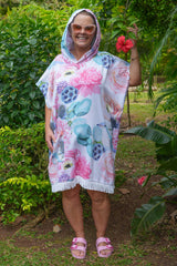 Woman wearing Anemone Nest poncho at the beach